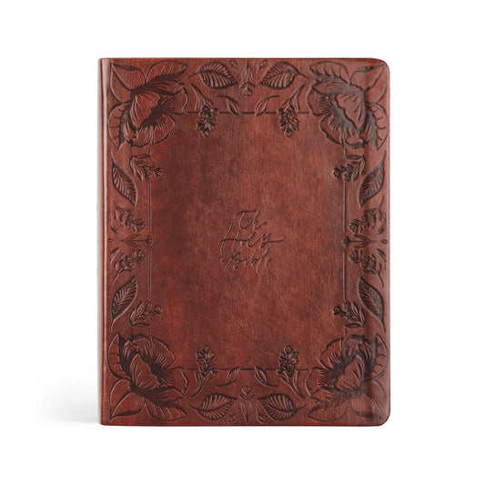dark brown leather bible, etch floral design around edges middle reads The Holy Bible