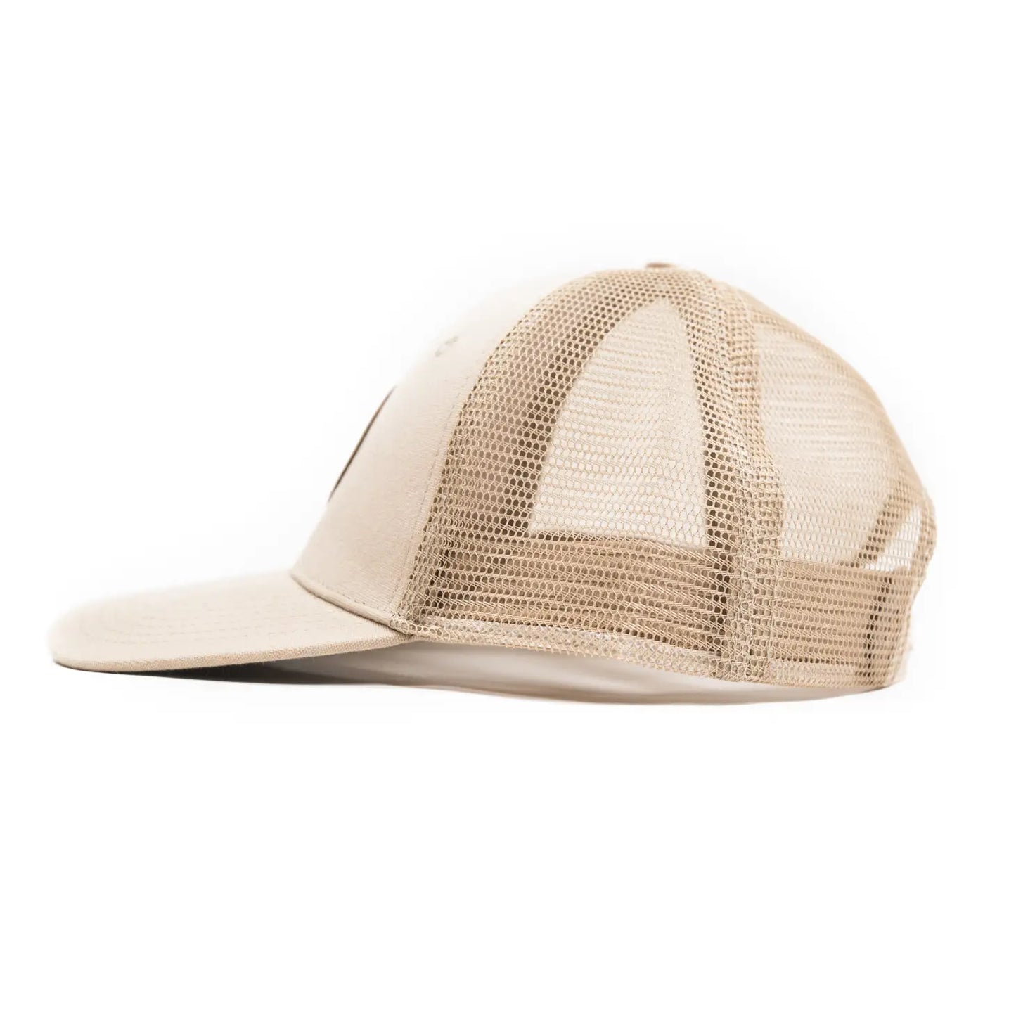 side view of the cream colored trucker hat