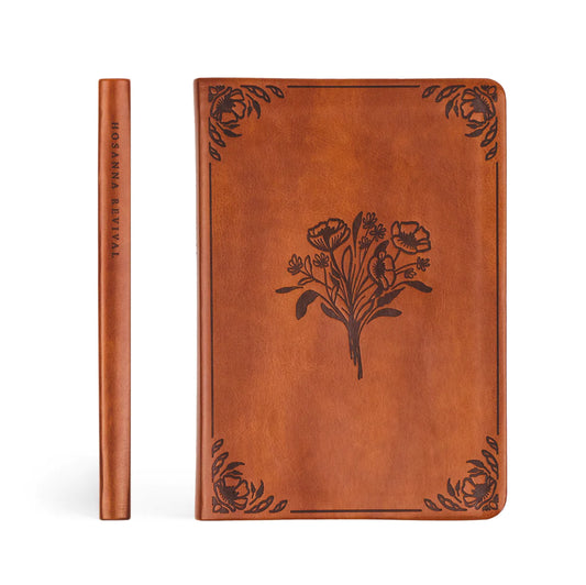 front and spine of brown smooth leather bible with floral accents etched in the corners and middle, spine reads "Hosanna Revival"