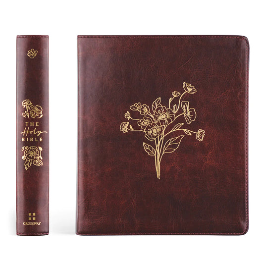 reddish brown soft leather bible spine and front cover, spine reads "The Holy Bible", the front has a beautiful etched floral print both in gold foil