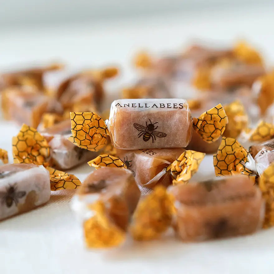 wrapped caramels, wrapper has the name Anellabees, with a bee, and the ends twisted look like a honeycomb